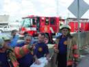 (l-r) Capt. Froeba  , Capt. Boudreaux, FF. Raymond, Capt. Juneau, and Lt.   Marrione (not pictured) talk about the material inside of the truck.